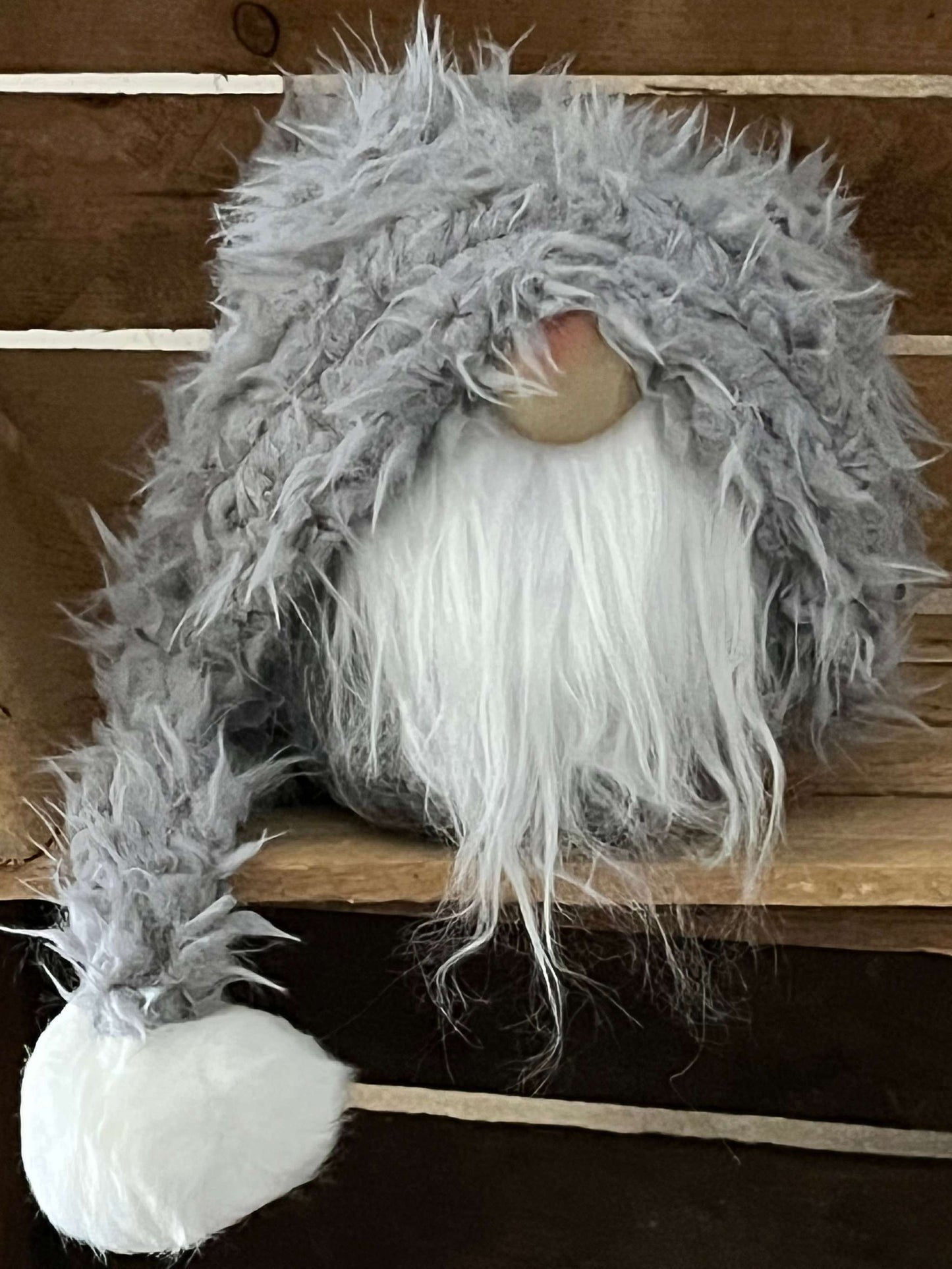 Gnome-shaped doorstop in brown and gray, 54 cm tall, ideal for winter decor.